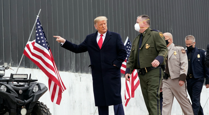 President Donald Trump tours a section of the U.S.-Mexico border wall