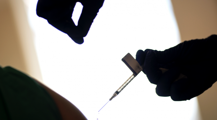 A person is injected with the COVID-19 vaccine
