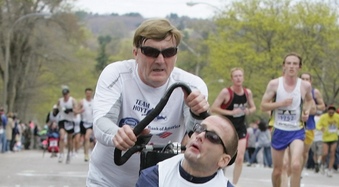 Dick Hoyt pushes his son Rick in the Boston Marathon