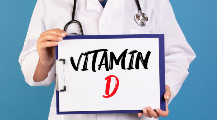 Doctor holding clipboard with Vitamin D text