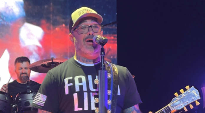 Aaron Lewis wearing a shirt that appears to read, 