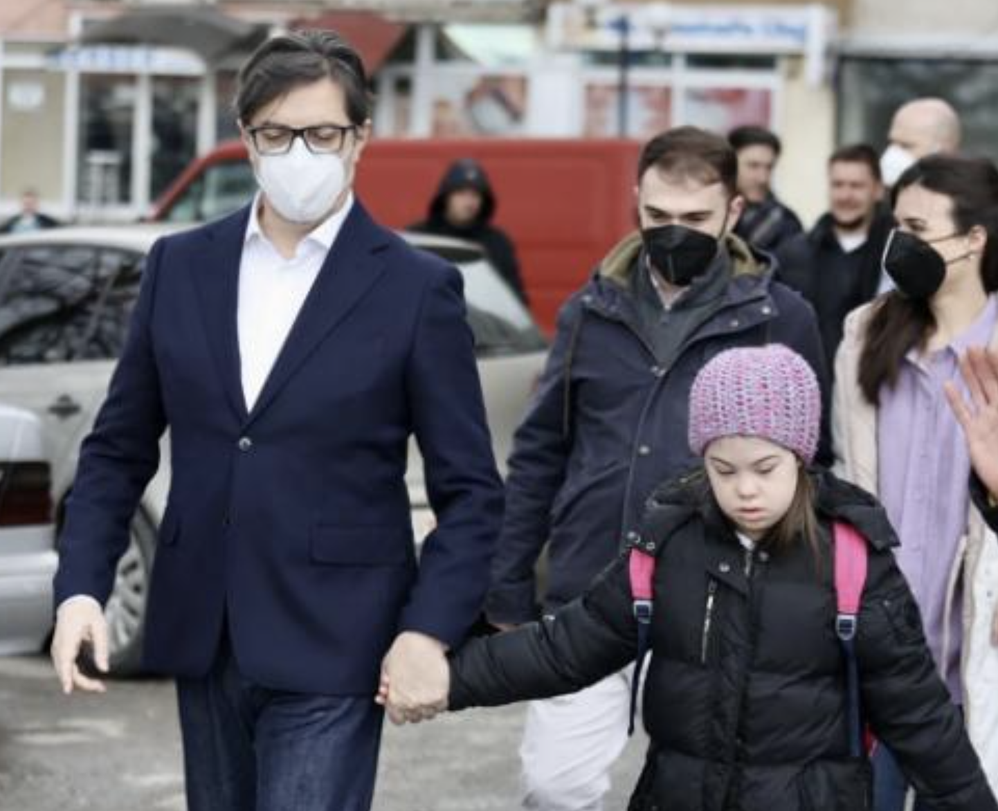 President Stevo Pendarovski held Embla Ademi's hand as he walked her to her school in the city of Gostivar on Monday.