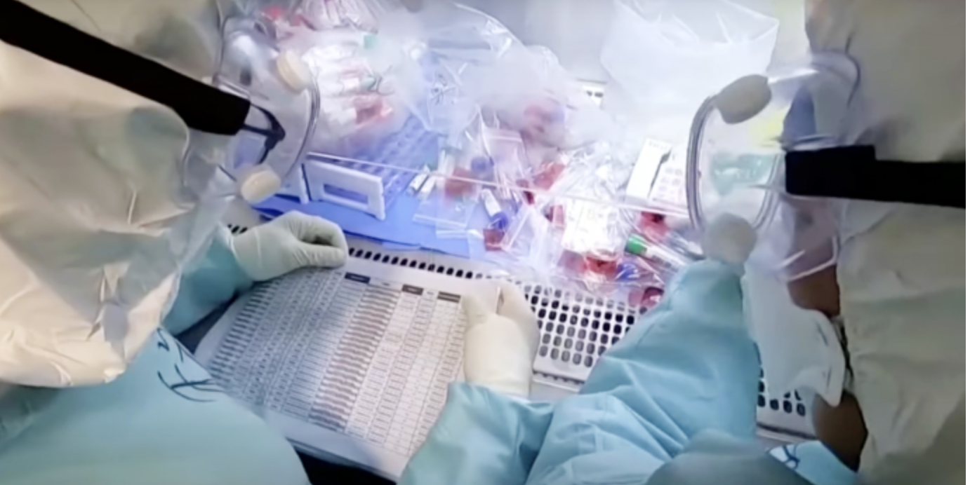 NRx Pharmaceuticals vaccine Lab techs work on a vaccine. / IMAGE: i24NEWS English via YouTube