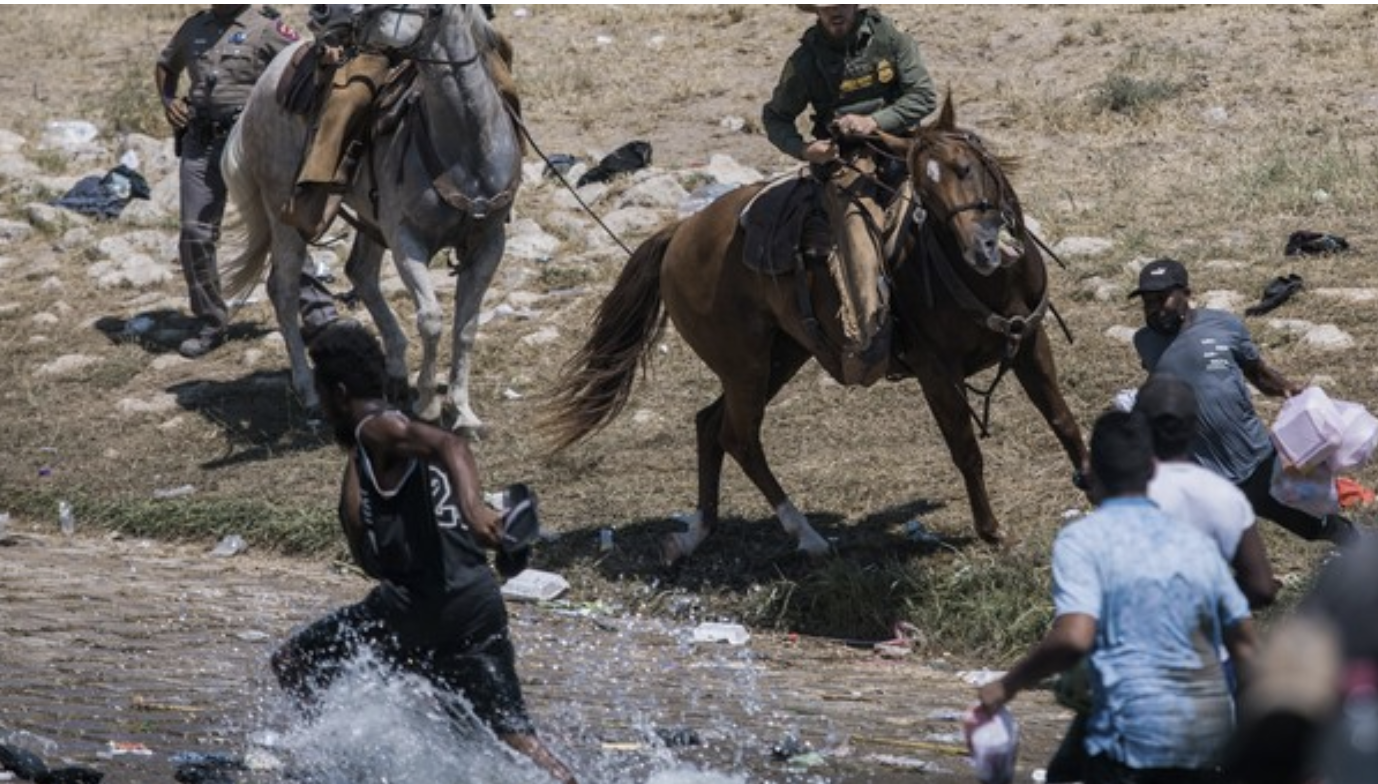 Mounted law enforcement offers with reins in their hands, which were falsely identified by Joe Biden as whips.
