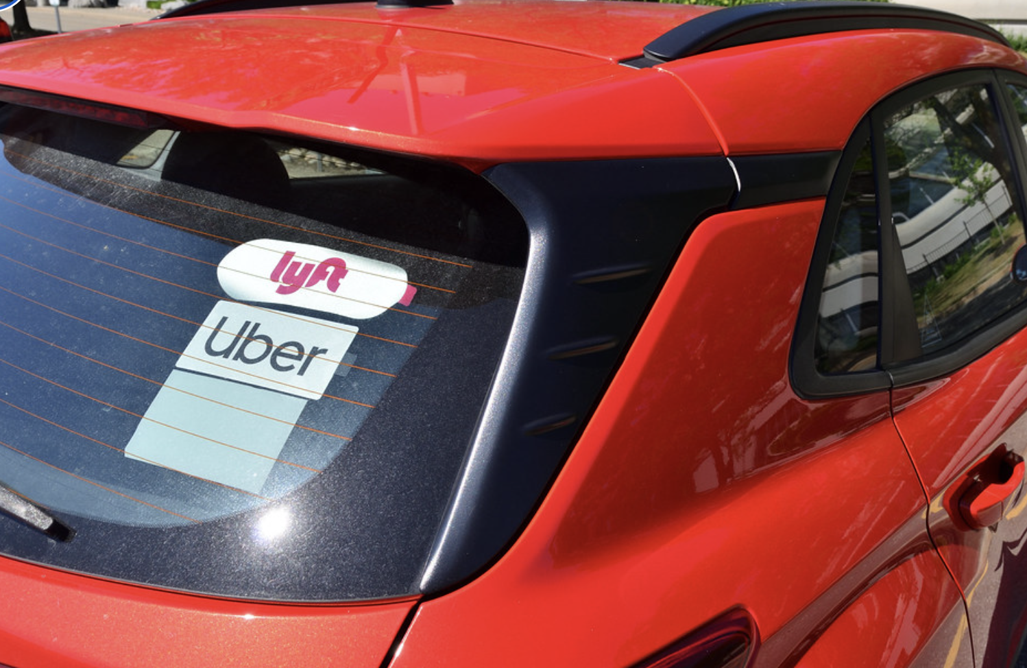 Vehicle with UBER sticker in rear window