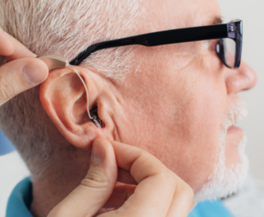 Man being fitted for a hearing aid