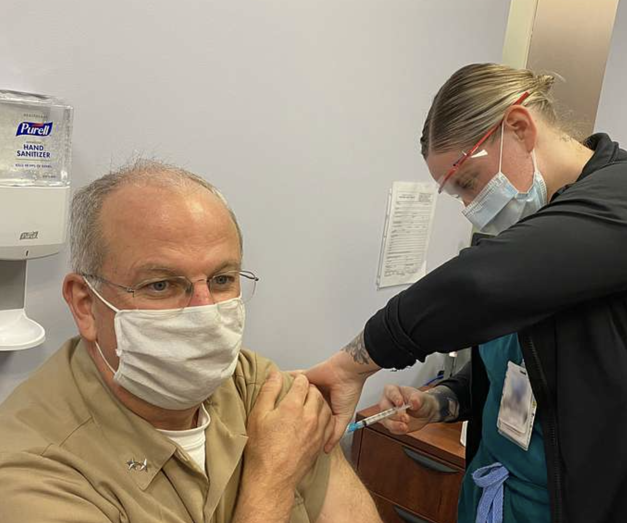 US Navy Surgeon General Rear Admiral Bruce Gillingham receives his annual flu immunization