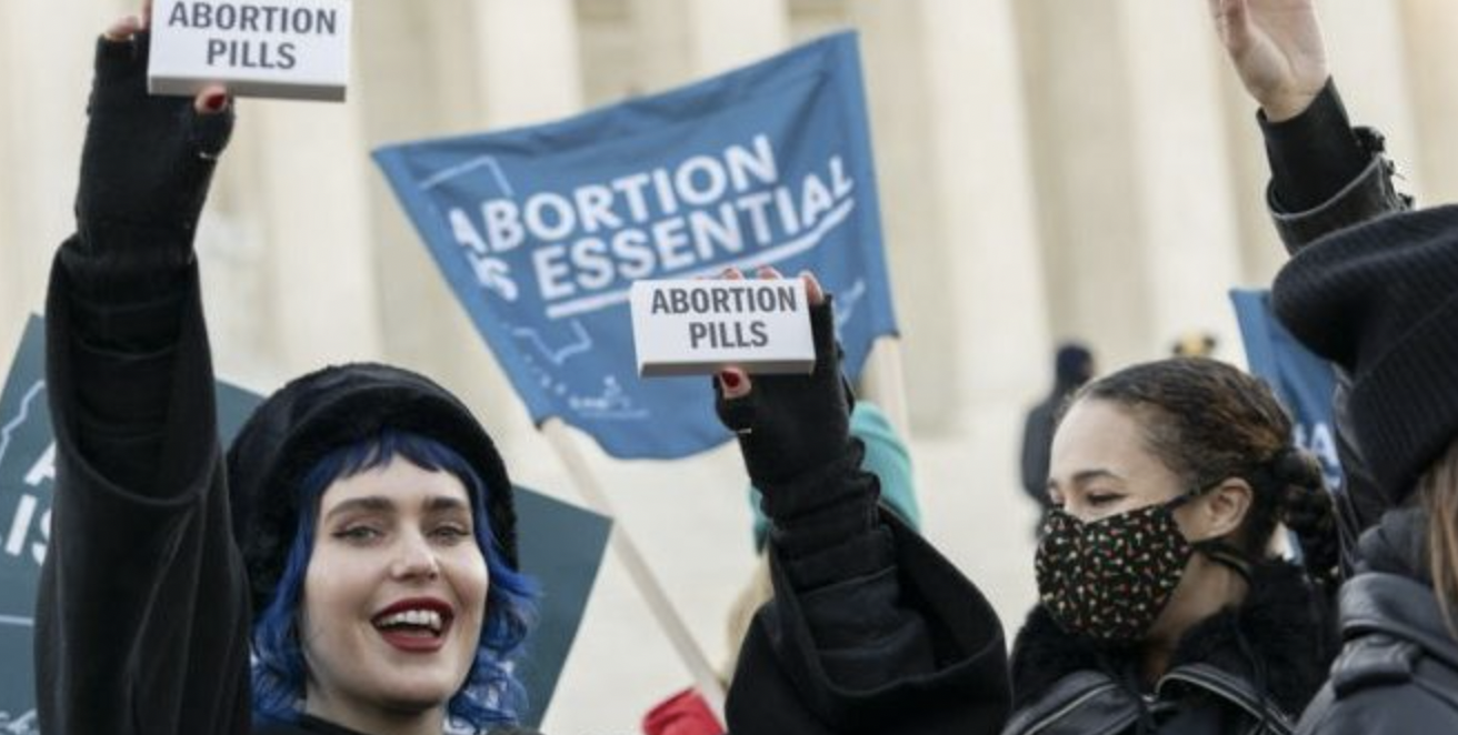 Abortion activists protest outside the Supreme Court. / PHOTO: AP