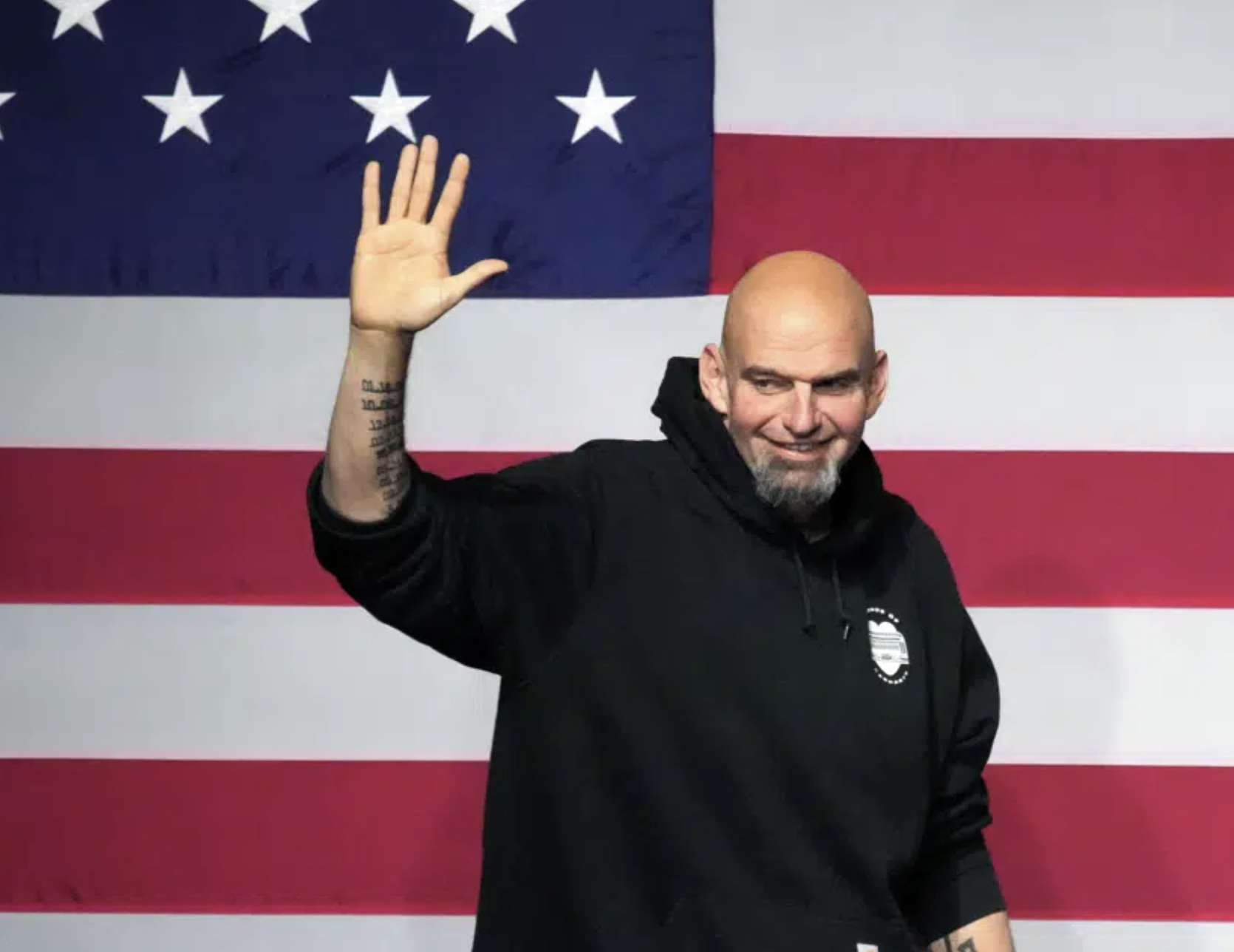John Fetterman takes the stage at an election night party in Pittsburgh on Nov. 9, 2022.