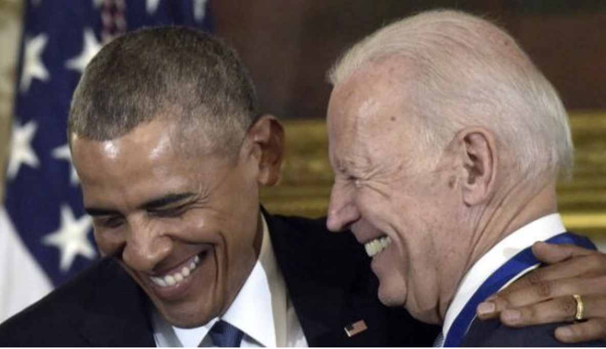 Barack Obama and Joe Biden share a laugh. / PHOTO: AP