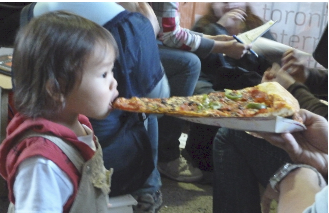 Girl eating pizza