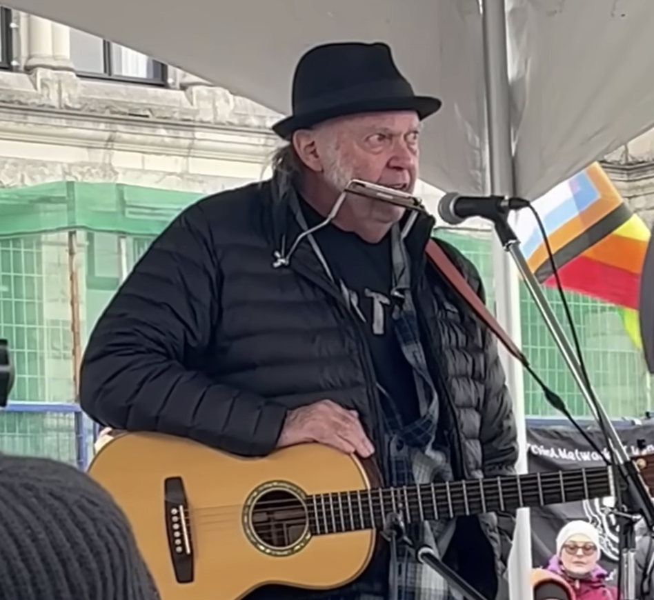 Neil Young makes surprise appearance at rally to protect old-growth forests.