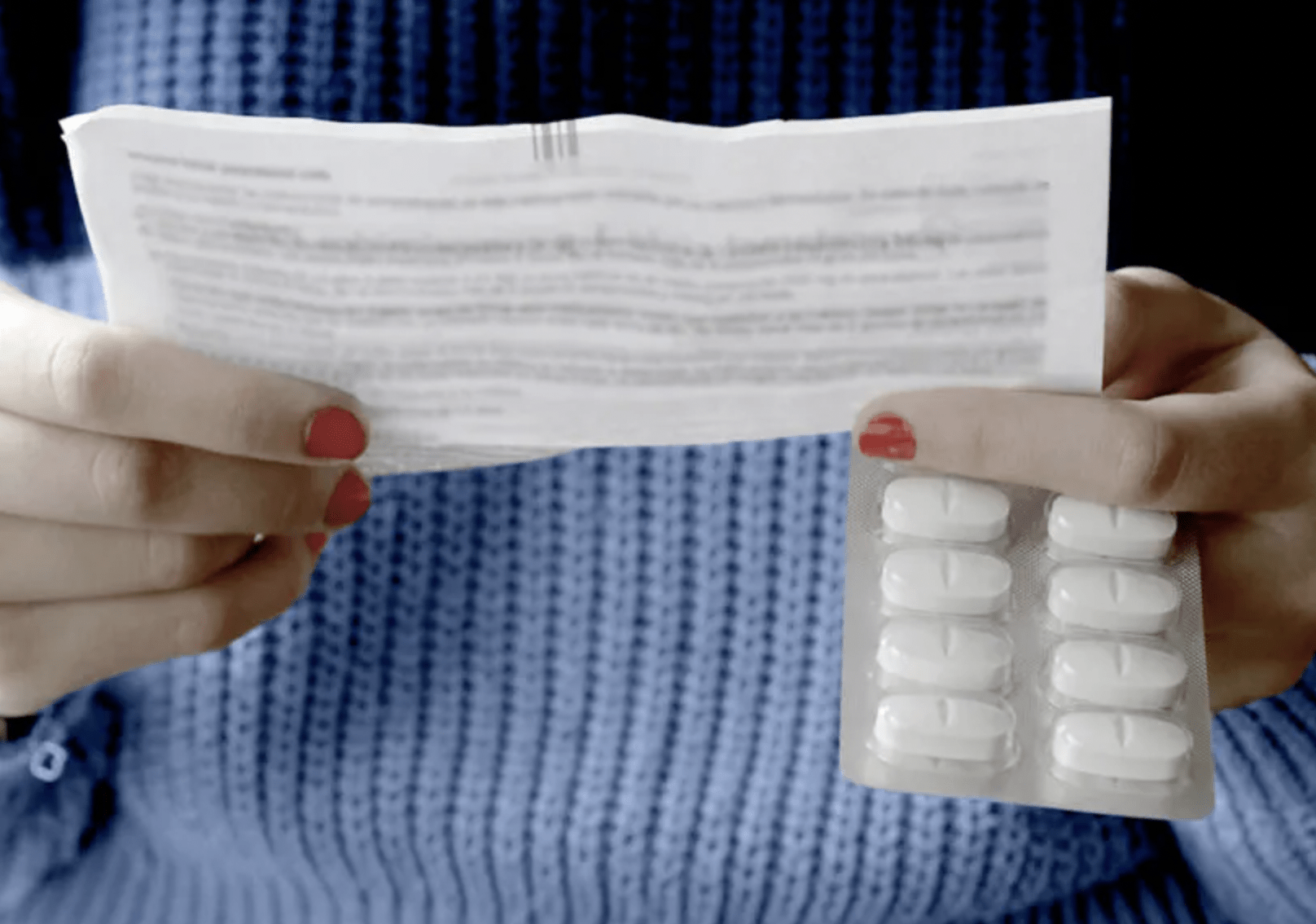 Woman holding a prescription drug insert