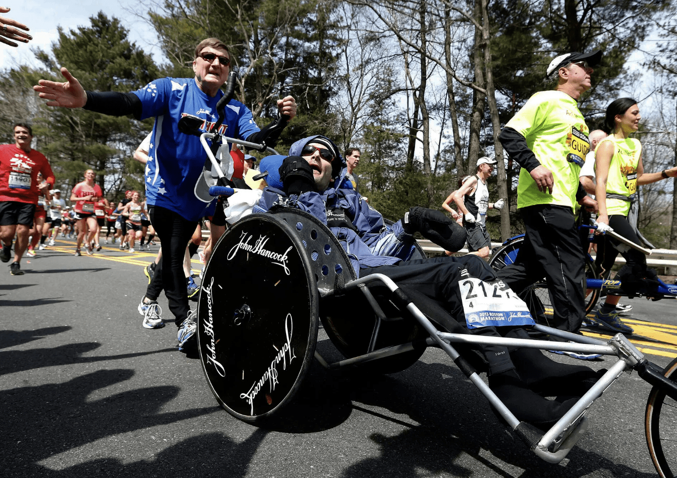 Rick Hoyt is pushed in a wheelchair by his father, Dick | Michael Dwyer/Associated Press