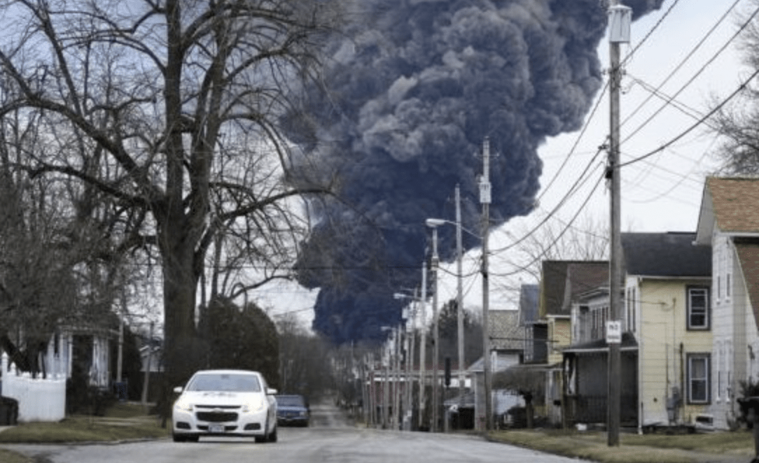A black plume rises over East Palestine, Ohio, as a result of a toxic train derailment and explosion. / PHOTO: AP