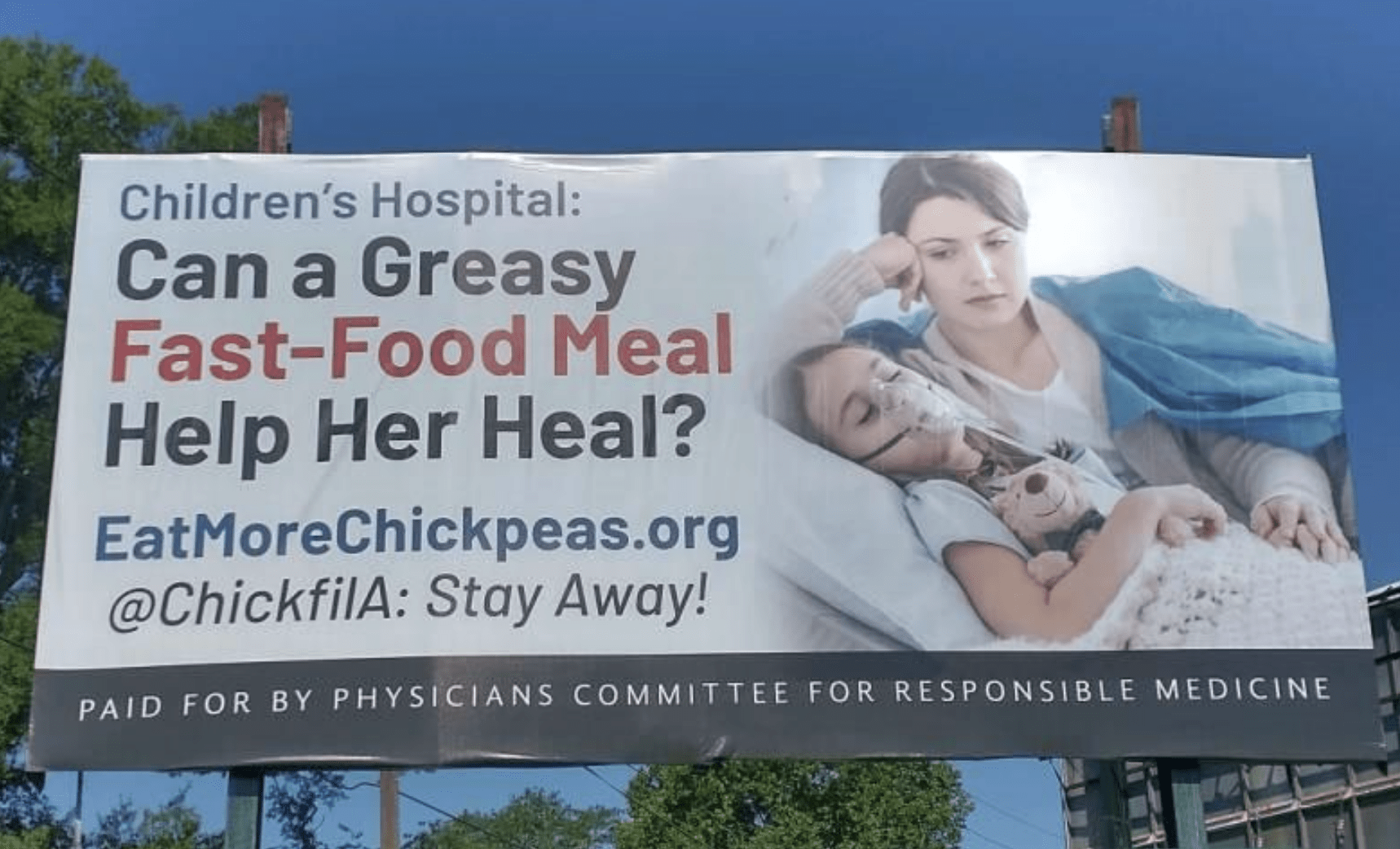 A billboard opposing a Chick-fil-A in Children's Hospital of Georgia stands outside the Augusta, Ga., medical facility in summer 2023.