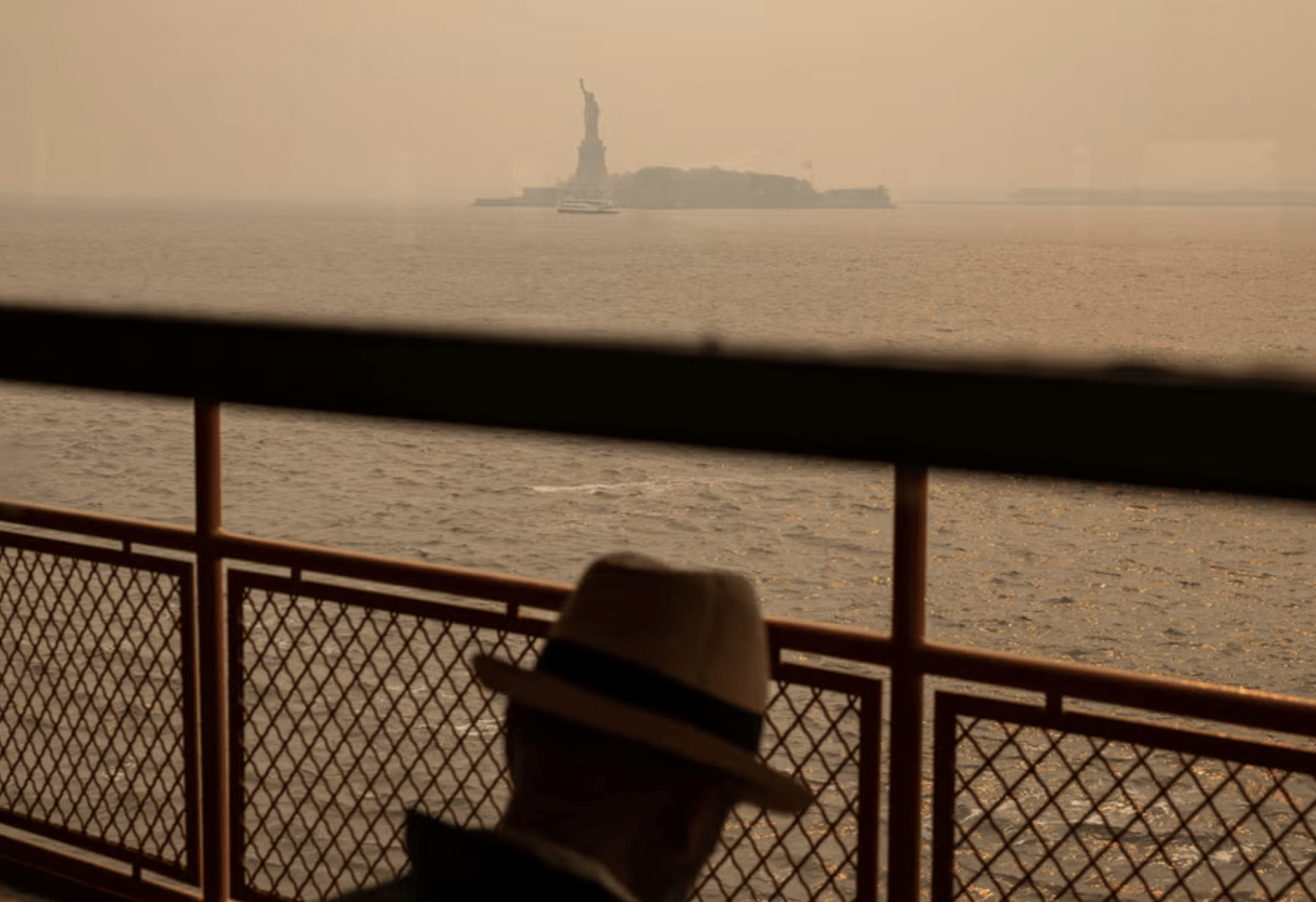 Hazy skies prevail above the Statue of Liberty