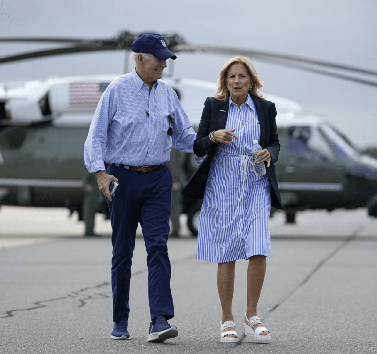 President Joe Biden and first lady Jill Biden walk to board Air Force One