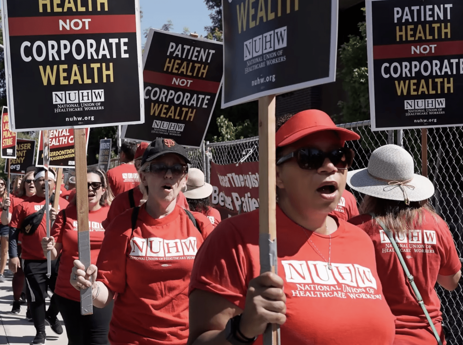 Rich Pedroncelli / AP Photo Kaiser Permanente mental health workers and supporters march outside a Kaiser facility in Sacramento, Calif., Monday, Aug. 15, 2022.
