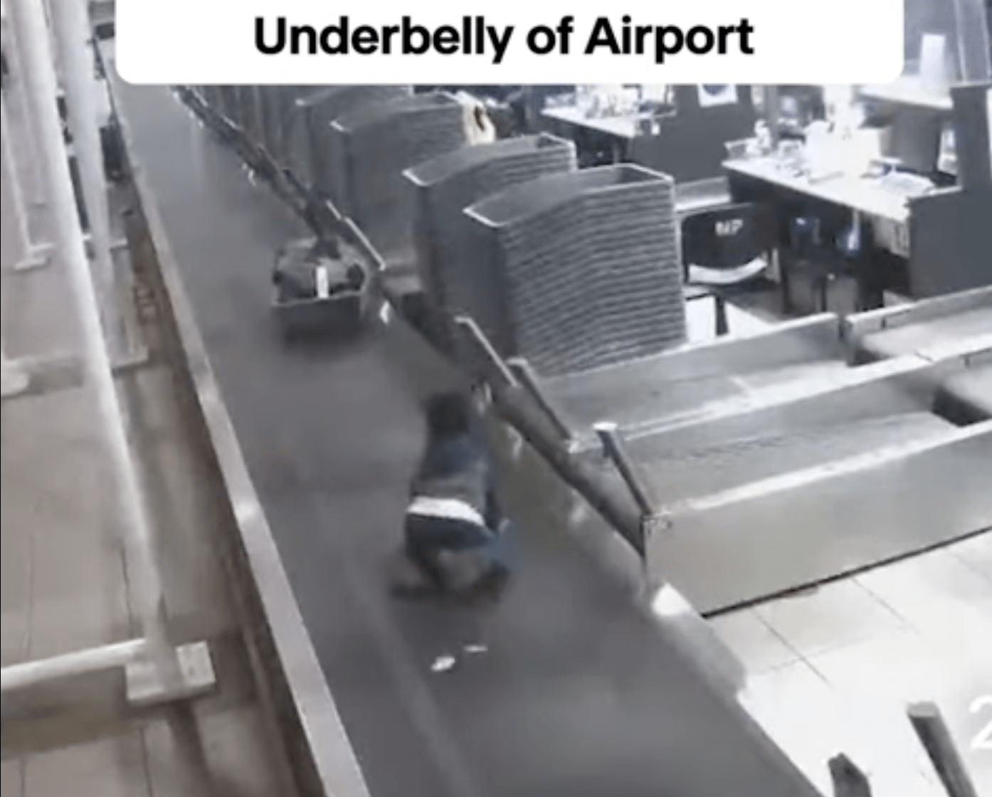 Boy rides airport luggage conveyor belt