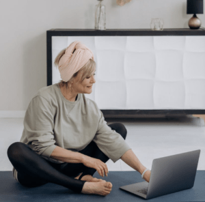 Woman using a laptop computer for fitness coaching