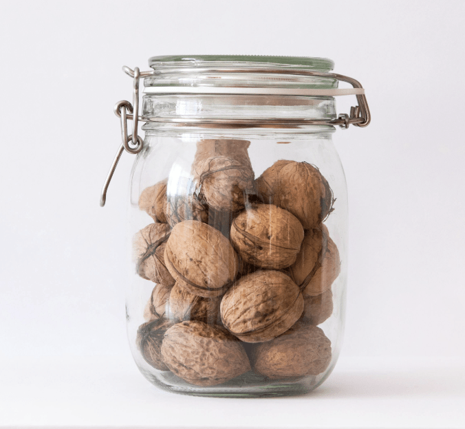File photo: walnuts in a clear glass jar